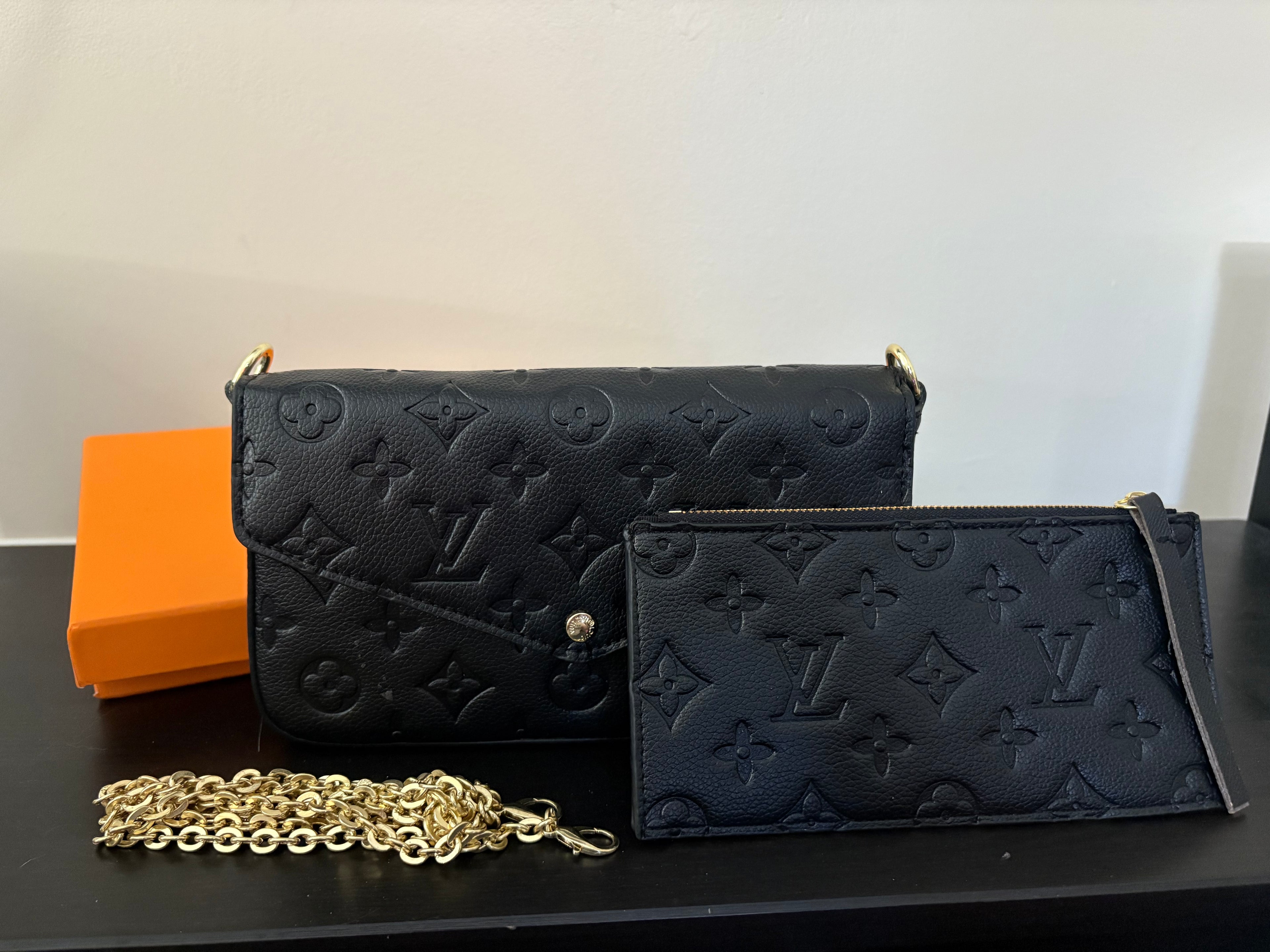 Black embossed pochette purse